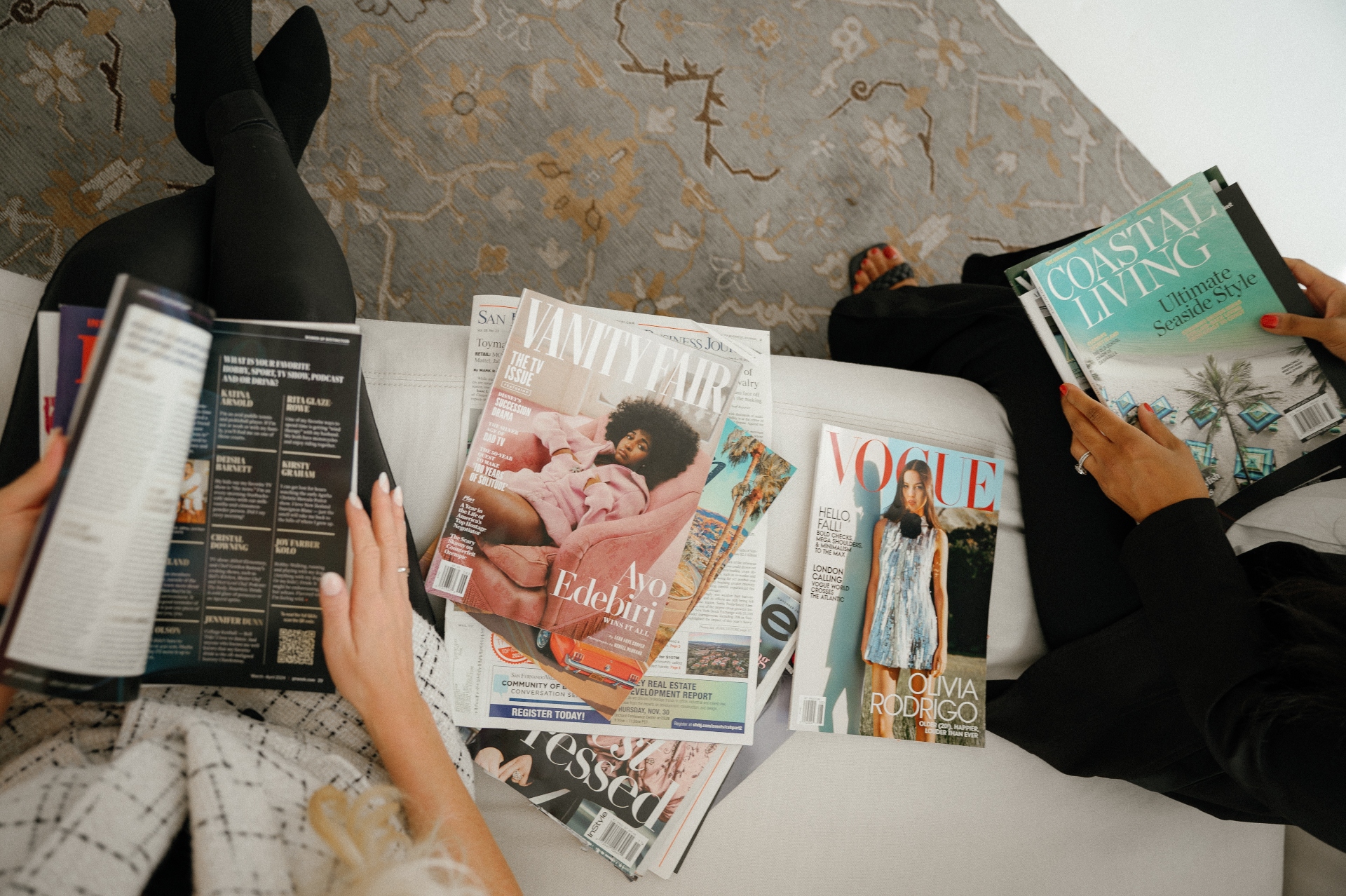 Magazine spreads including Vanity Fair, Vogue, and Coastal Living representing media coverage